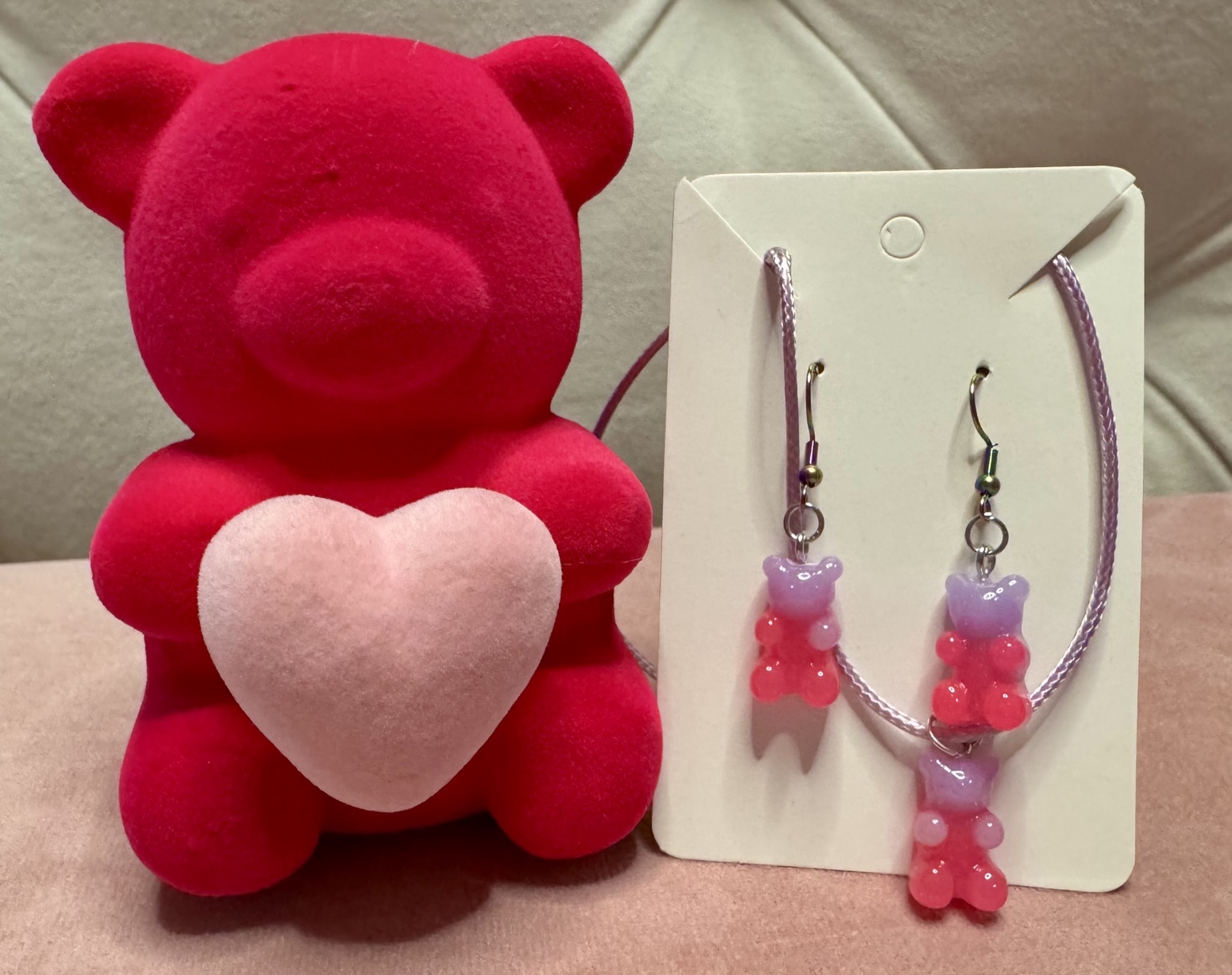 Pink bear plush with gummy jewelry